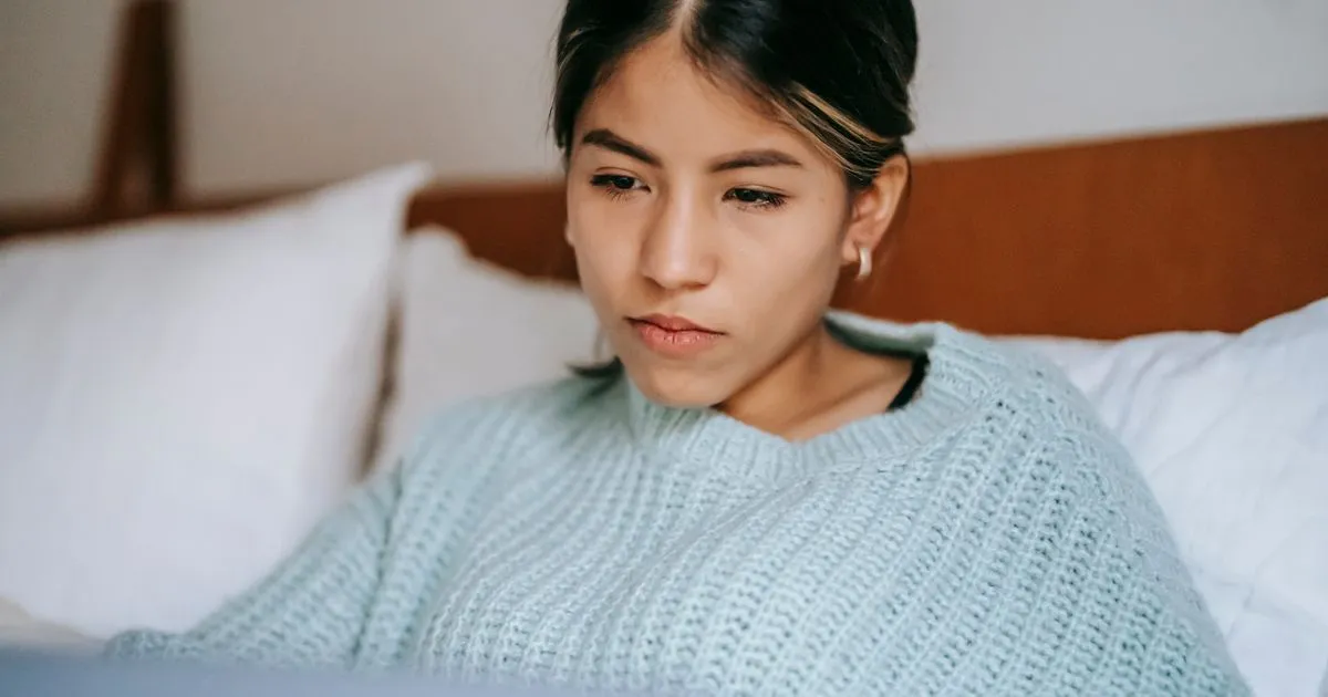 Woman reviewing bad credit quick loans options on her laptop