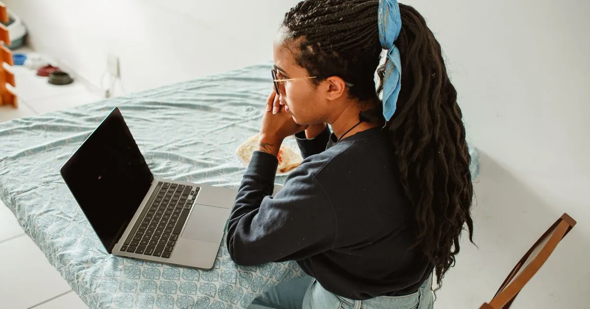 Writing an email to contact LoanQuickly from a laptop at home