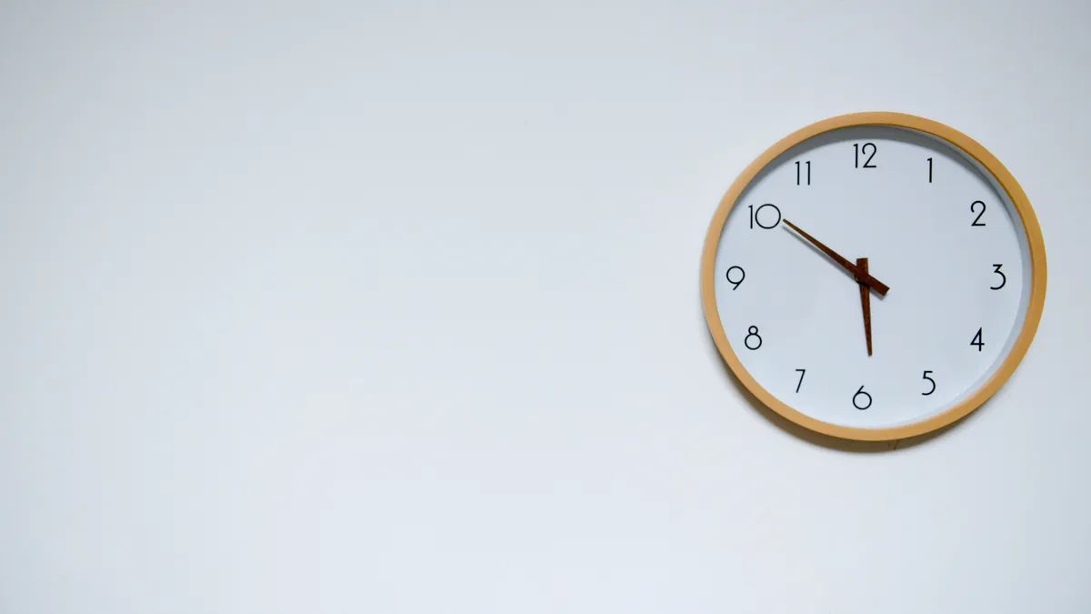 Wall clock showing ten past ten, the morning window when quick cash loans are usually paid the same business day
